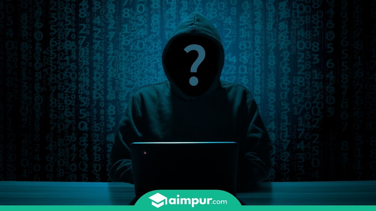 A hacker without face with his laptop