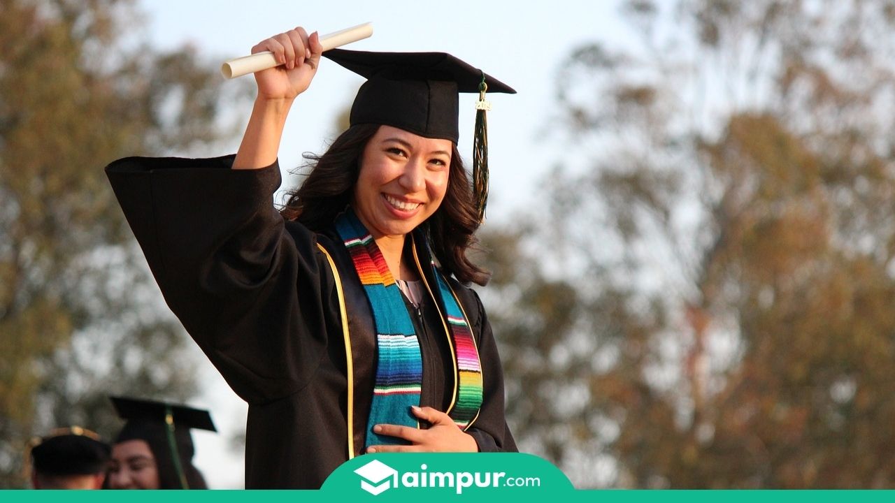 a girl with her diploma certificate
